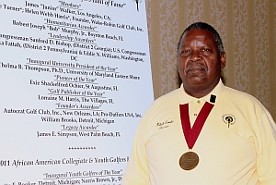 Malachi Knowles displays the Presidential Medal received from UMES