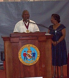 Malachi Knowles, Founder accepts the Presidential Award from Dr. Thelma B. Thompson, President of UMES