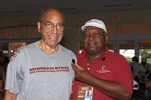 Earl Graves, Sr. of Black Enterprise receives an AAGHOF pin from Malachi Knowles, Founder, AAGHOF, ICYG & Editor of Golfforeanyone.com