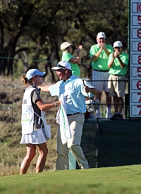Freds hugs caddy after chipping in on the 18th hole at the AT&T Championship