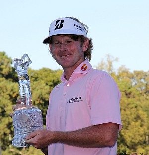 Brandt Snedeker holding the Tour Championship Trophy.